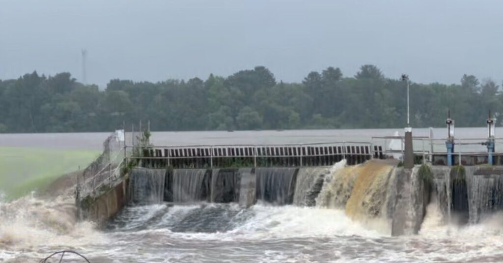 Heavy rains cause river to overflow dam in Wisconsin, putting small town at risk Heavy Rains Cause River To Overflow Dam In Wisconsin, Putting